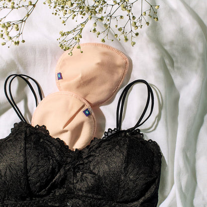 Wkładki laktacyjne wielorazowego użytku w kolorach jasnoróżowym i czarnym - Lansinoh