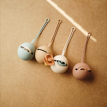 Mushie - Etui na smoczek Kula Ball Shifting Sand