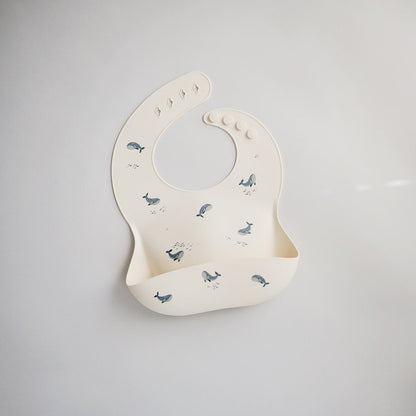 Śliniak silikonowy - Mushie Wielorybki